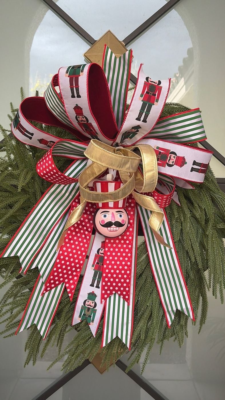 Custom nutcracker-themed layered holiday ribbon bow with greenery