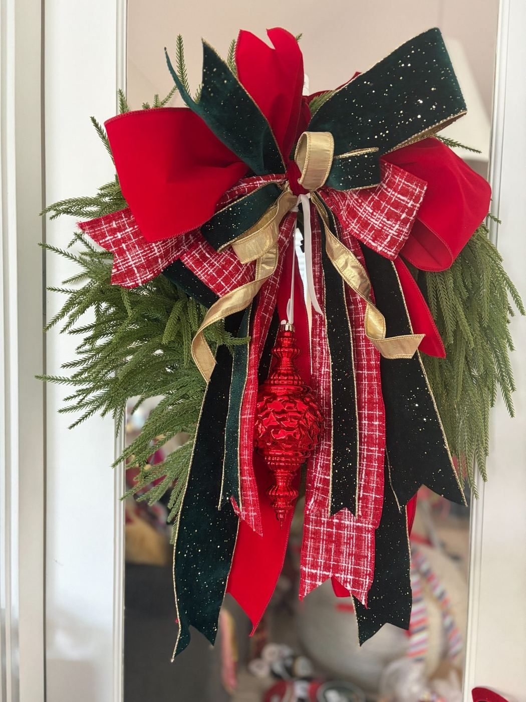 Layered crimson and evergreen holiday bow